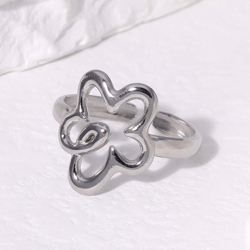 Anillo ajustable con flor plateado. Anillo ajustable para todos los dedos